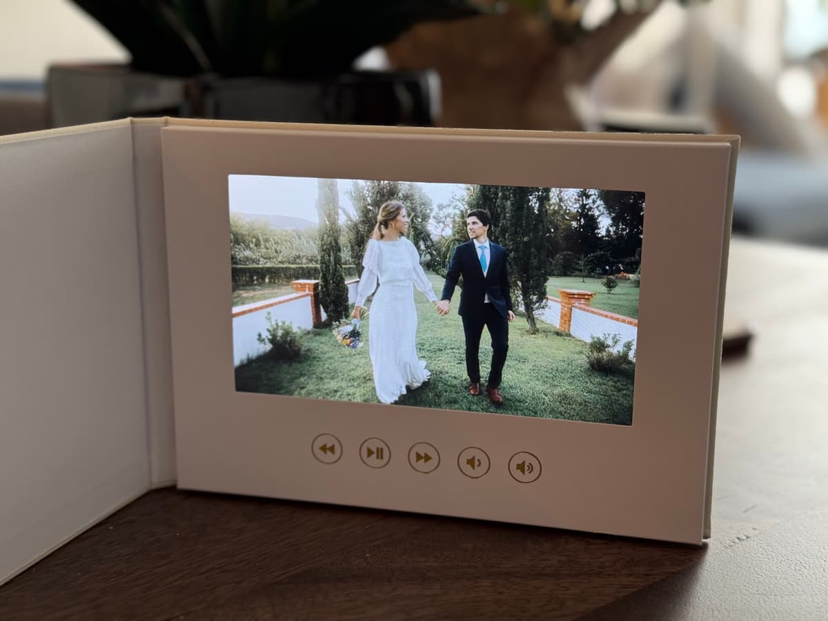 Video book displaying wedding couple on screen